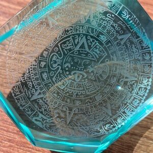 Hand carved Aztec Calendar and Pyramid on natural volcanic glass.